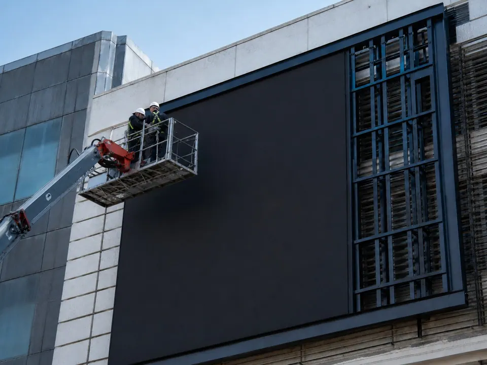 Facade LED cabinets installed from an aerial work platform